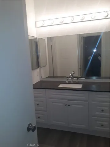 a bathroom with a sink and mirror
