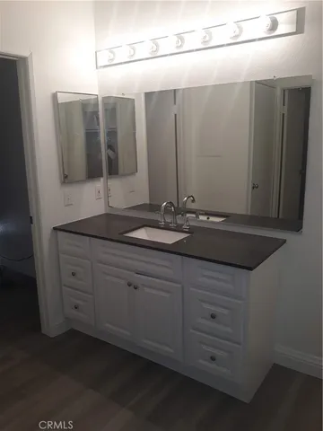 a bathroom with a toilet and bathtub