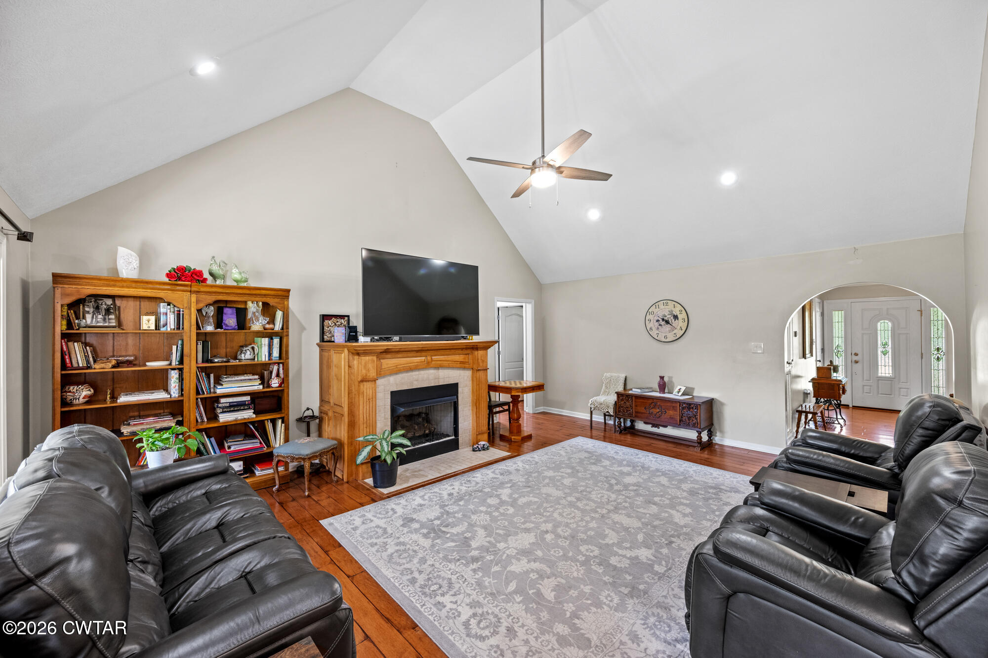 492 Joe Horton Road Lexington, TN 38351 - Photo 8 of 49 a living room with furniture a fireplace and a flat screen tv