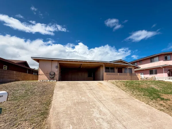 a front view of a house with yard