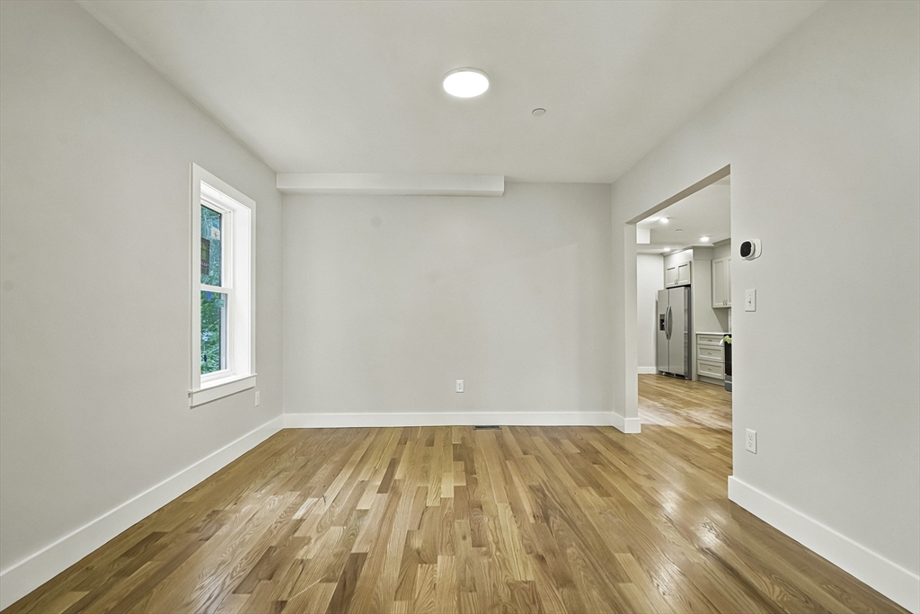 4 Mayhew Street Framingham, MA 01702 - Photo 10 of 42 a view of a room with wooden floor and a window
