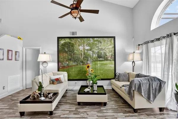 a living room with furniture and a large window