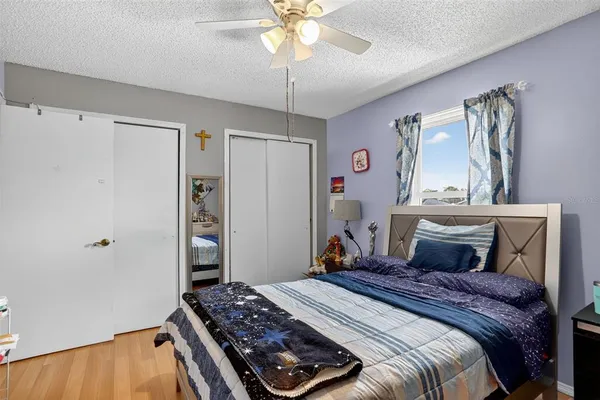 a bedroom with furniture and a chandelier