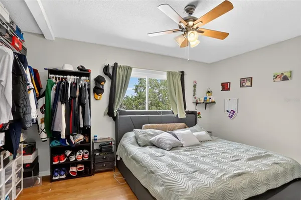 a bedroom with a bed and a chandelier