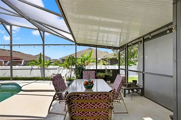 a dining room with furniture and garden view