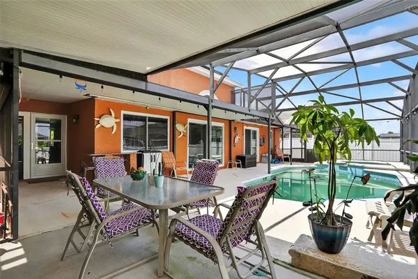 a view of a swimming pool with a lounge chair
