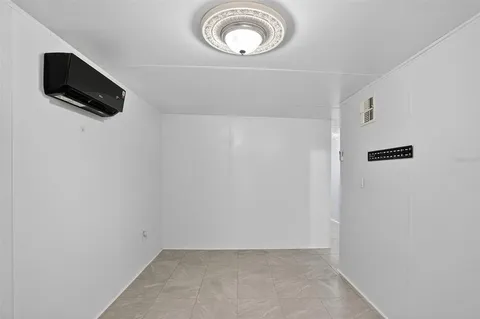 a view of a kitchen with refrigerator and microwave