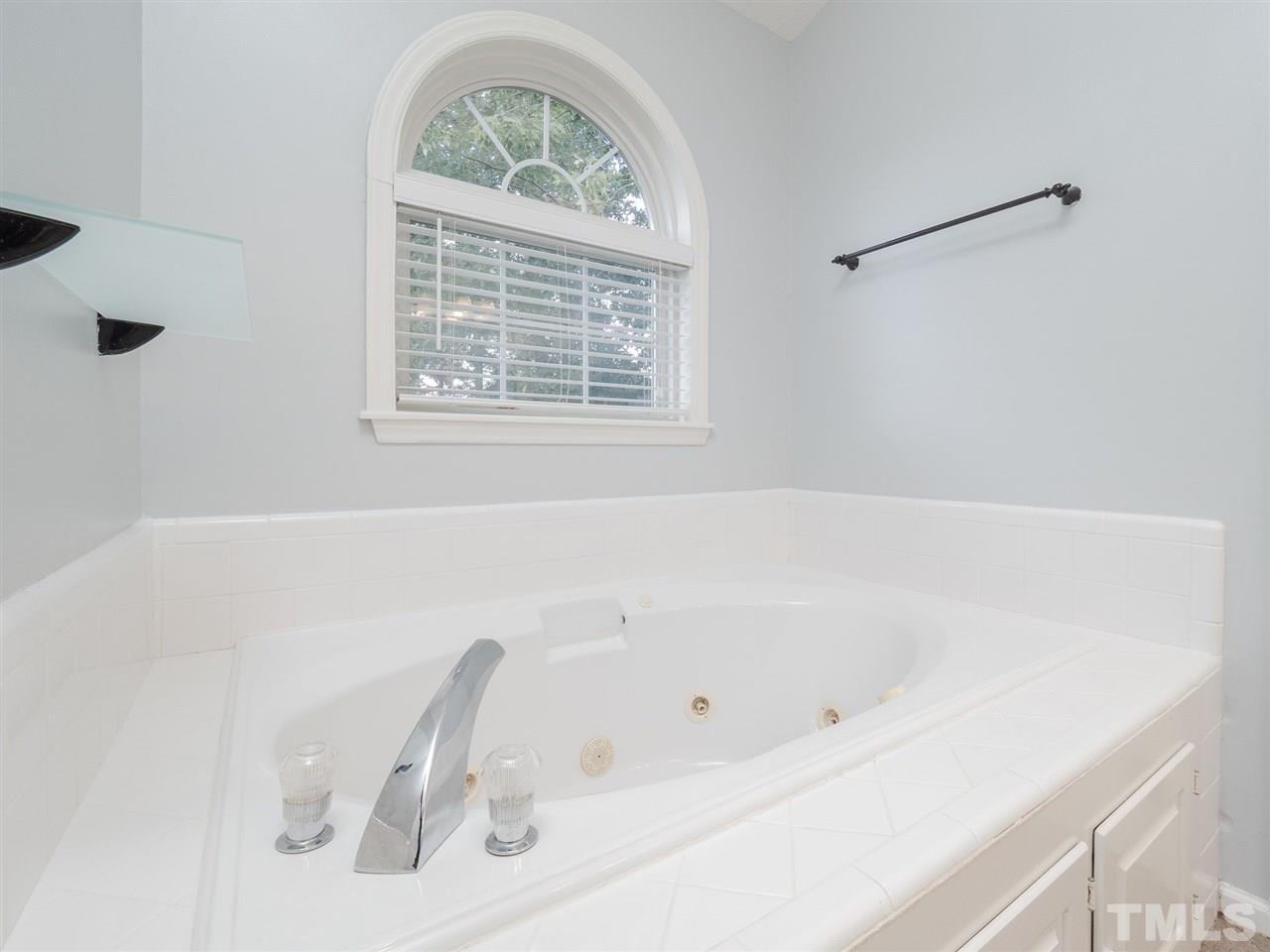 6816 Coventry Ridge Road Raleigh, NC 27616 - Photo 14 of 26 a white bath tub sitting next to a window