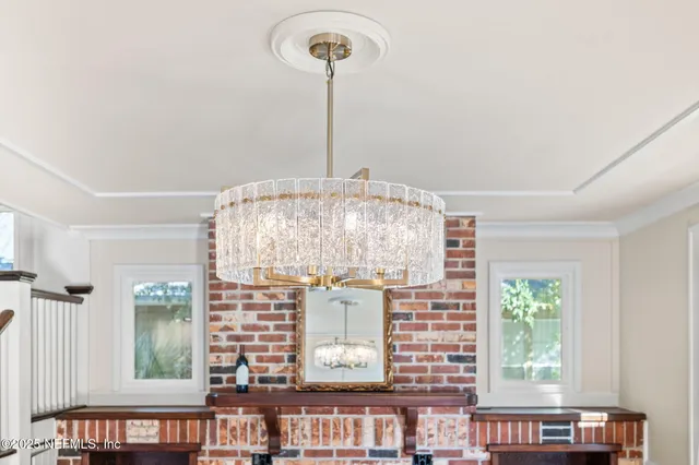 a view of a large window with chandelier in front of it