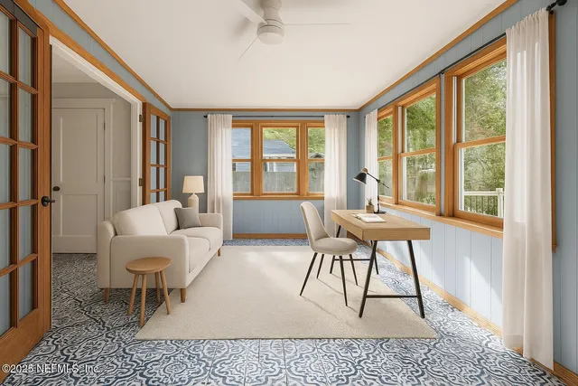 a living room with furniture a large window and a table