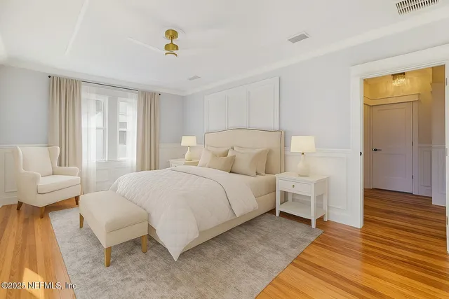 a spacious bedroom with a bed and a couch