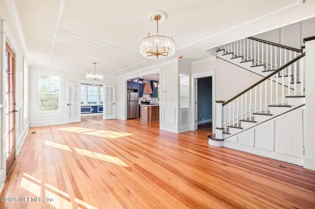 a view of an entryway with wooden floor