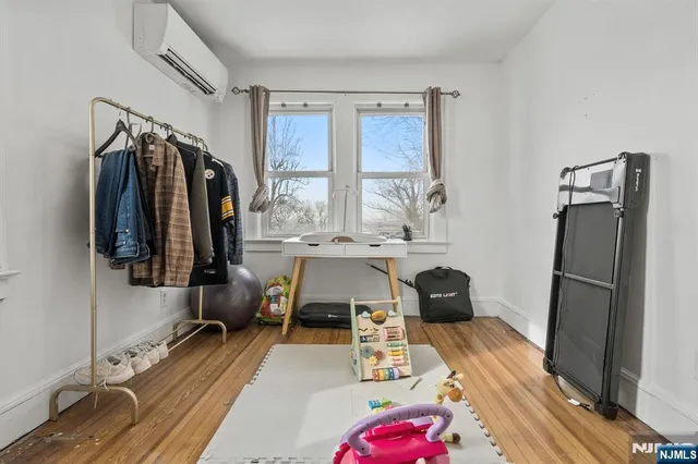 a bedroom with a bed and a walk in closet