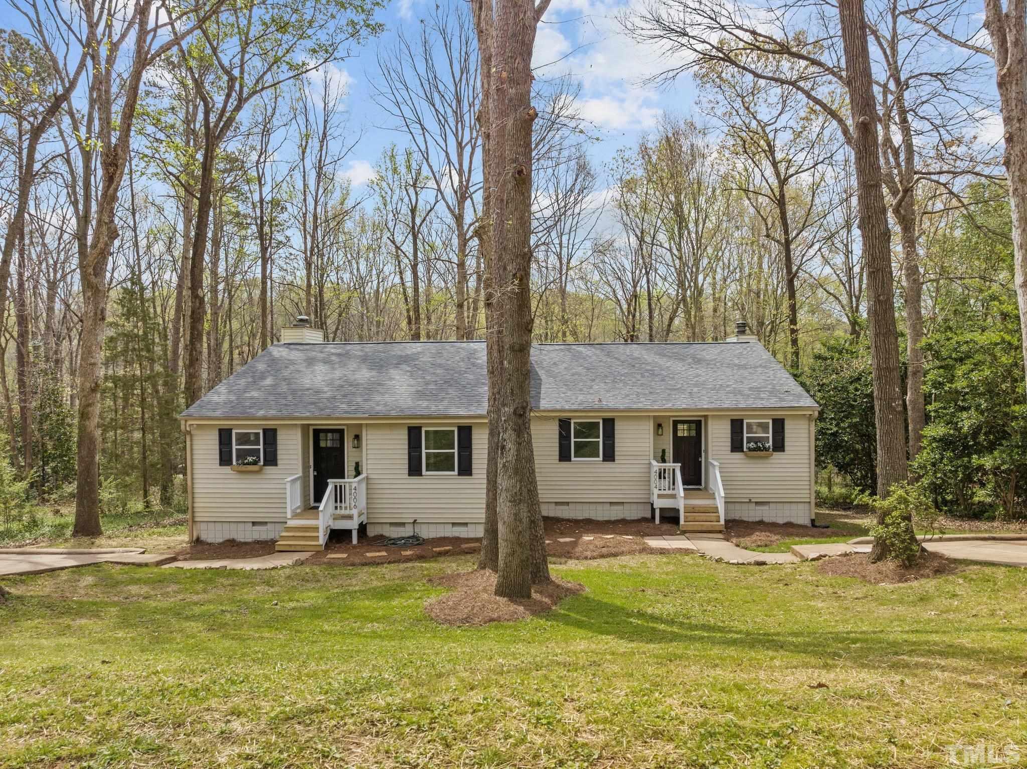 4006 Arckelton Drive, Unit 4006 & 4004 Raleigh, NC 27612 - Photo 1 of 34 a front view of a house with swimming pool and porch