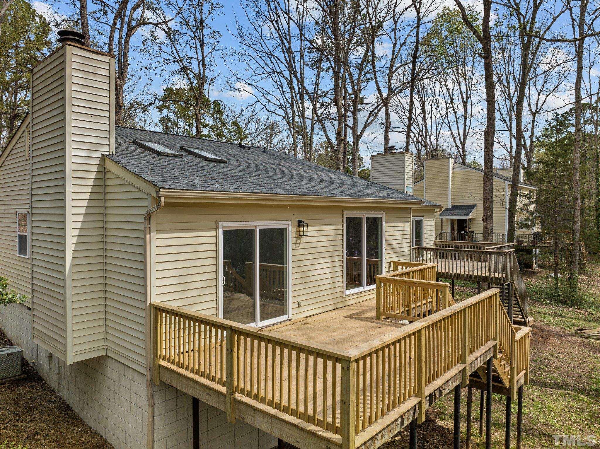 4006 Arckelton Drive, Unit 4006 & 4004 Raleigh, NC 27612 - Photo 11 of 34 a view of a house with a wooden fence