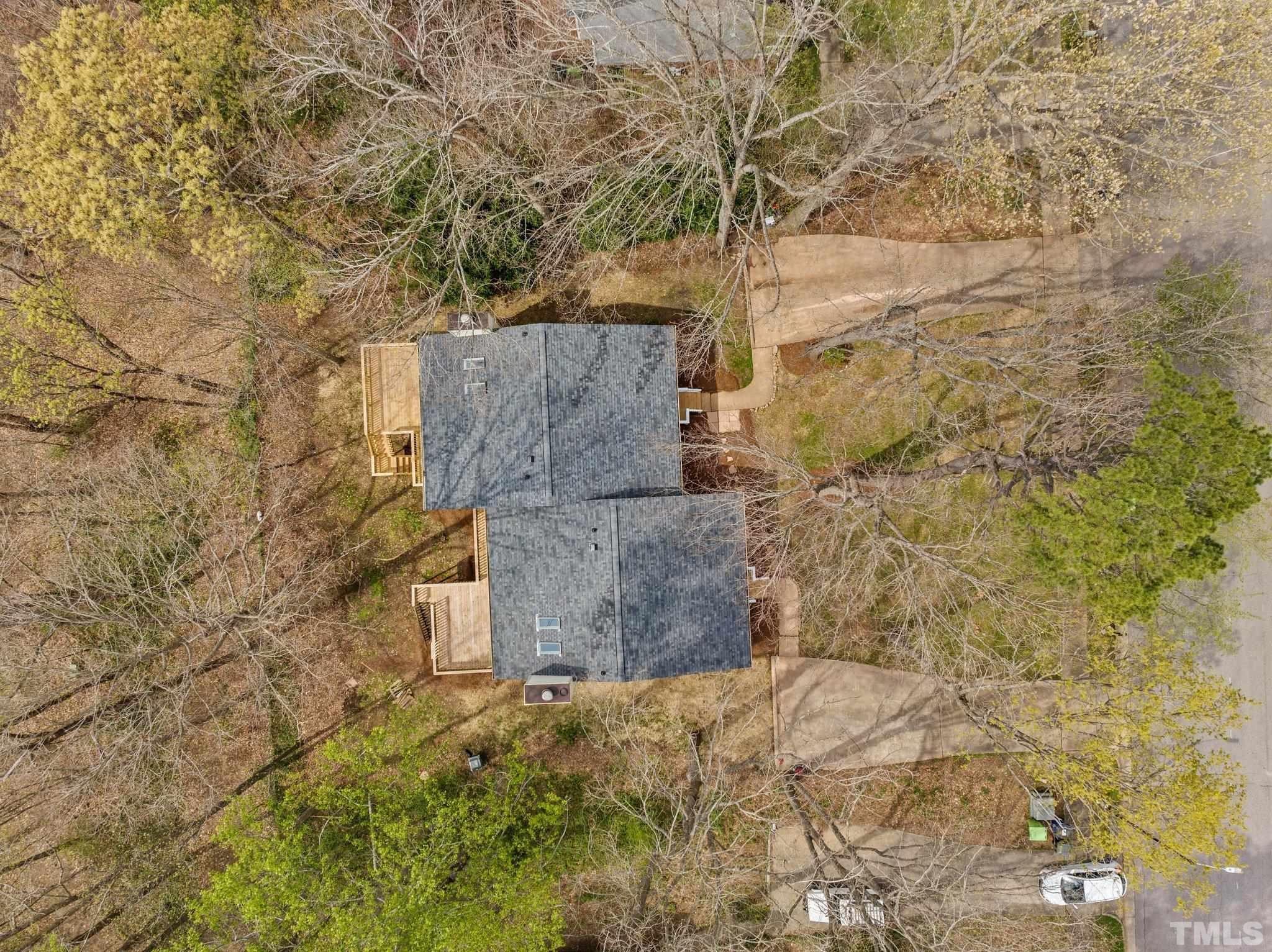 4006 Arckelton Drive, Unit 4006 & 4004 Raleigh, NC 27612 - Photo 14 of 34 a brick building with a tree in front of it