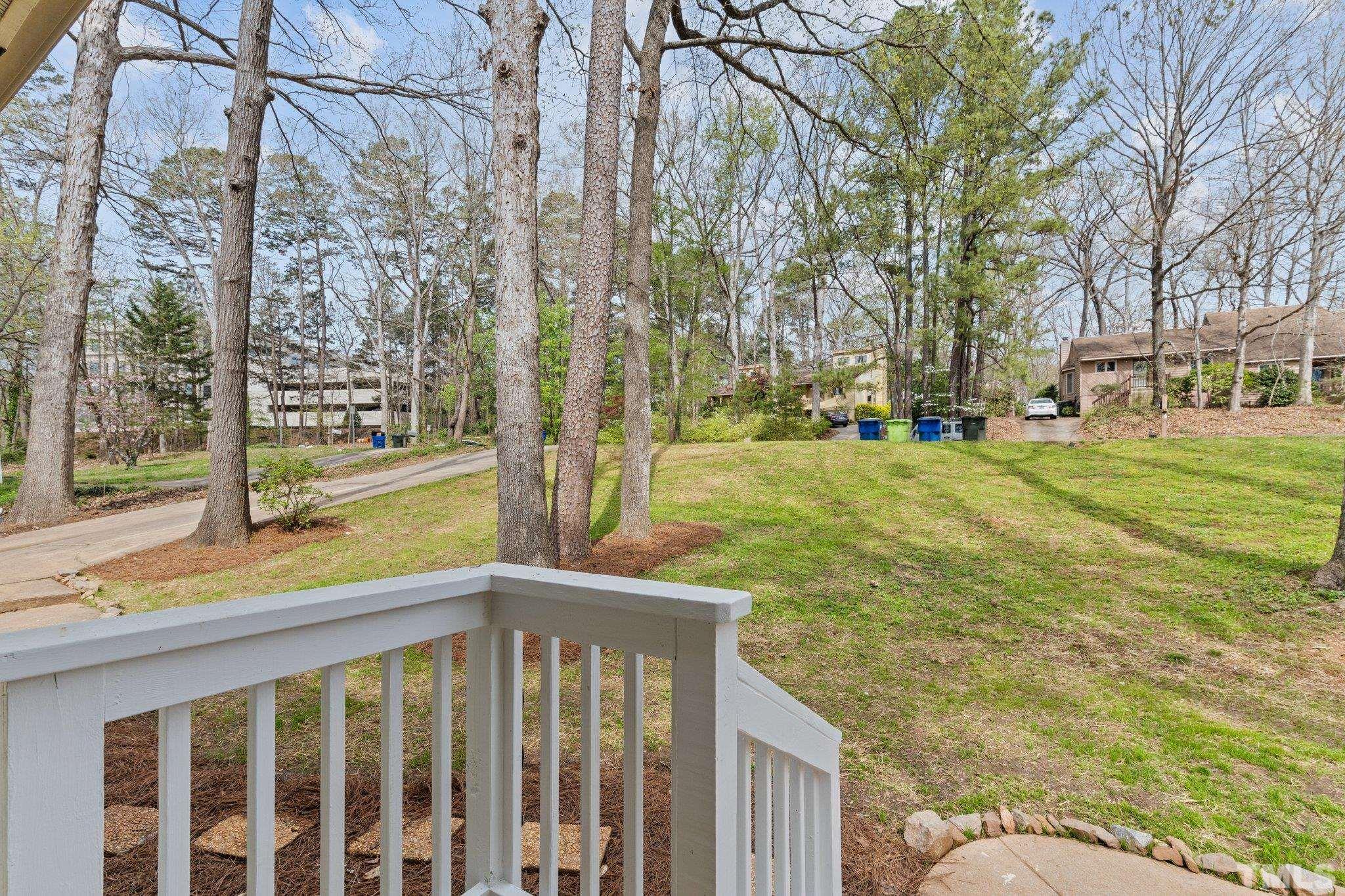 4006 Arckelton Drive, Unit 4006 & 4004 Raleigh, NC 27612 - Photo 26 of 34 a view of a porch with a yard