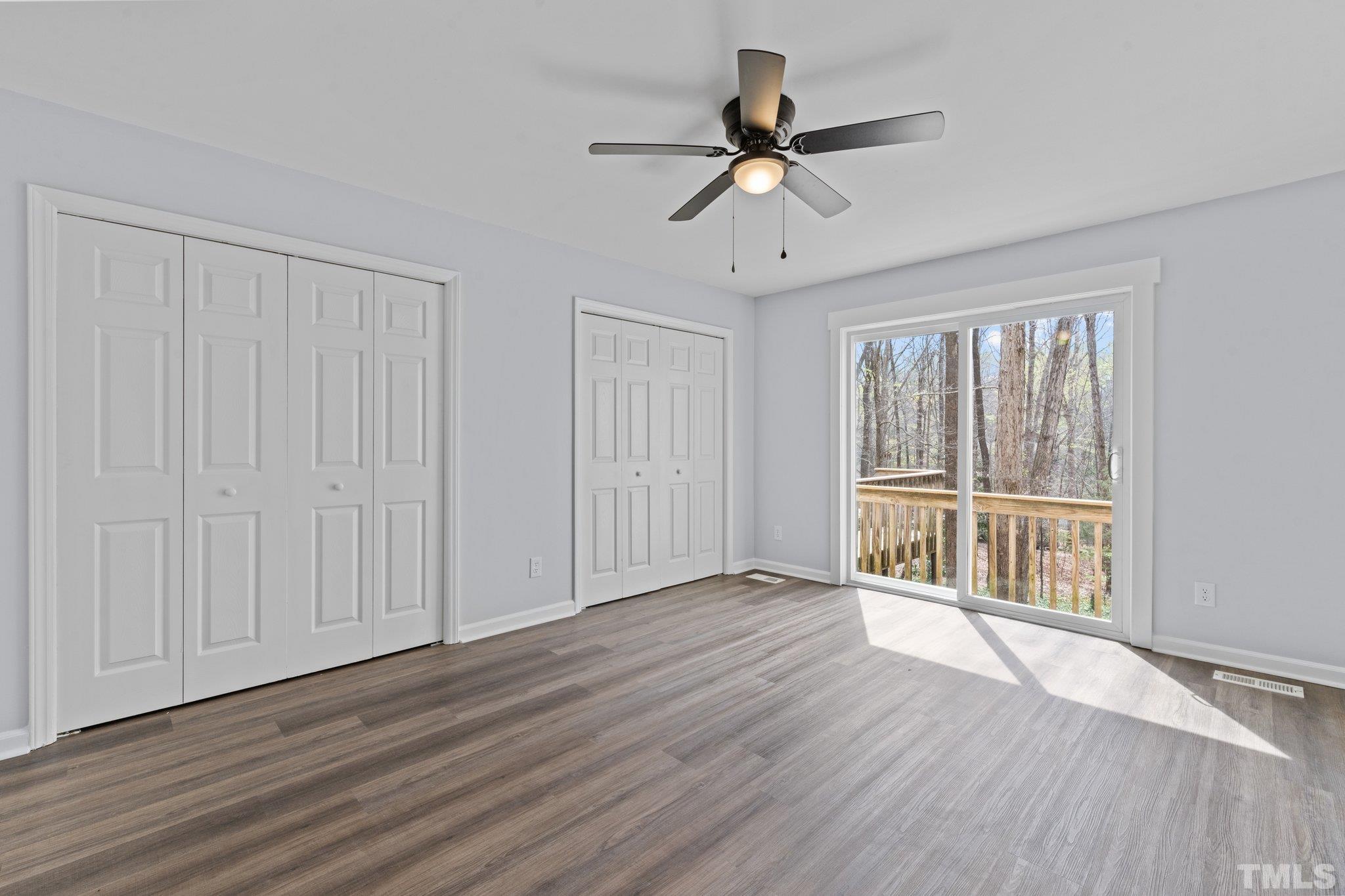 4006 Arckelton Drive, Unit 4006 & 4004 Raleigh, NC 27612 - Photo 33 of 34 a view of an empty room with wooden floor and a window