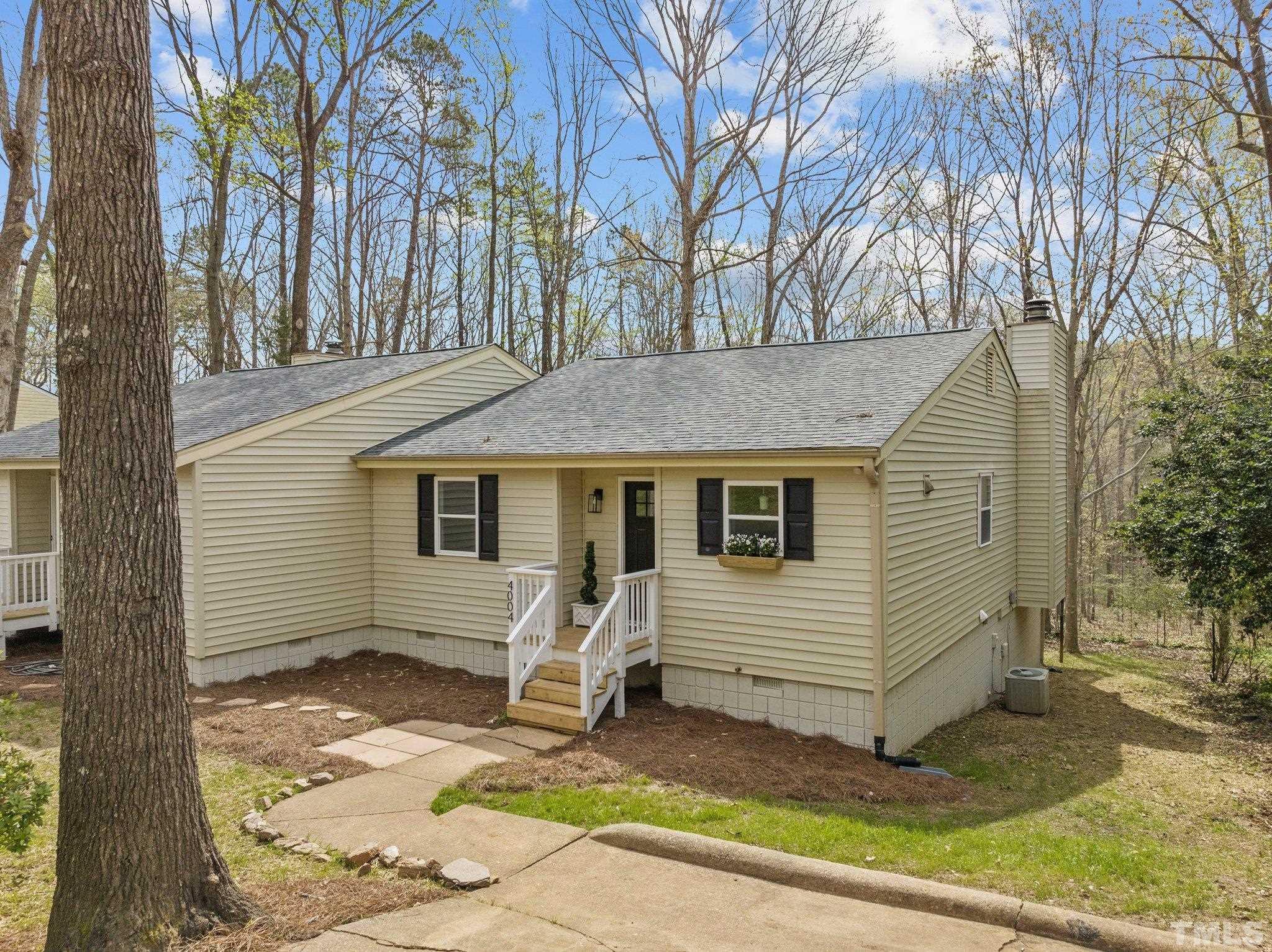 4006 Arckelton Drive, Unit 4006 & 4004 Raleigh, NC 27612 - Photo 4 of 34 a view of a house with a yard
