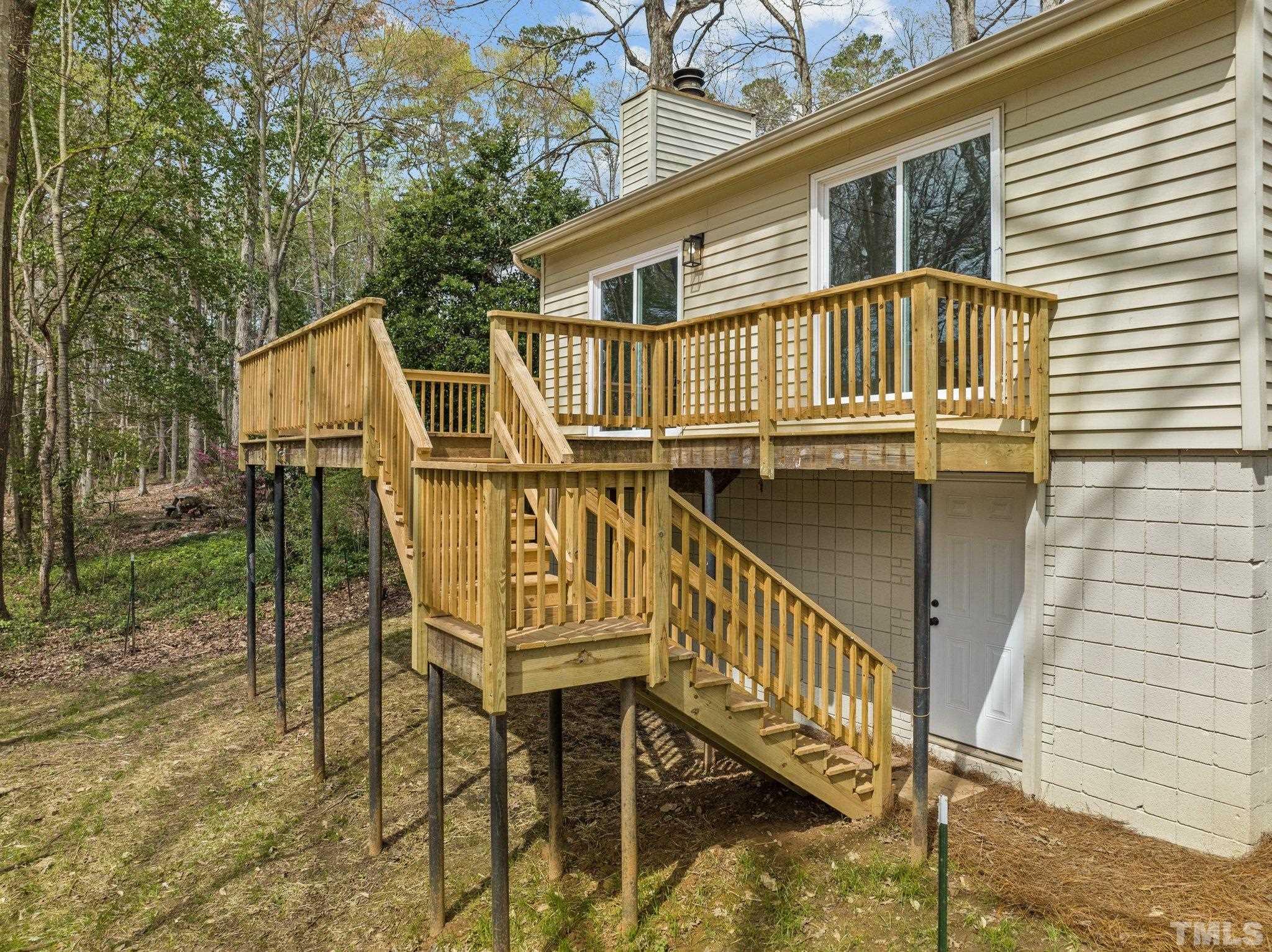 4006 Arckelton Drive, Unit 4006 & 4004 Raleigh, NC 27612 - Photo 5 of 34 a view of a house with backyard and deck