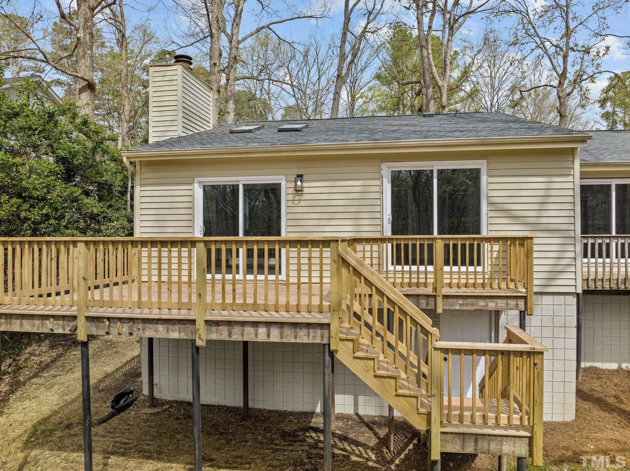 4006 Arckelton Drive, Unit 4006 & 4004 Raleigh, NC 27612 - Photo 7 of 34 a front view of a house with a balcony