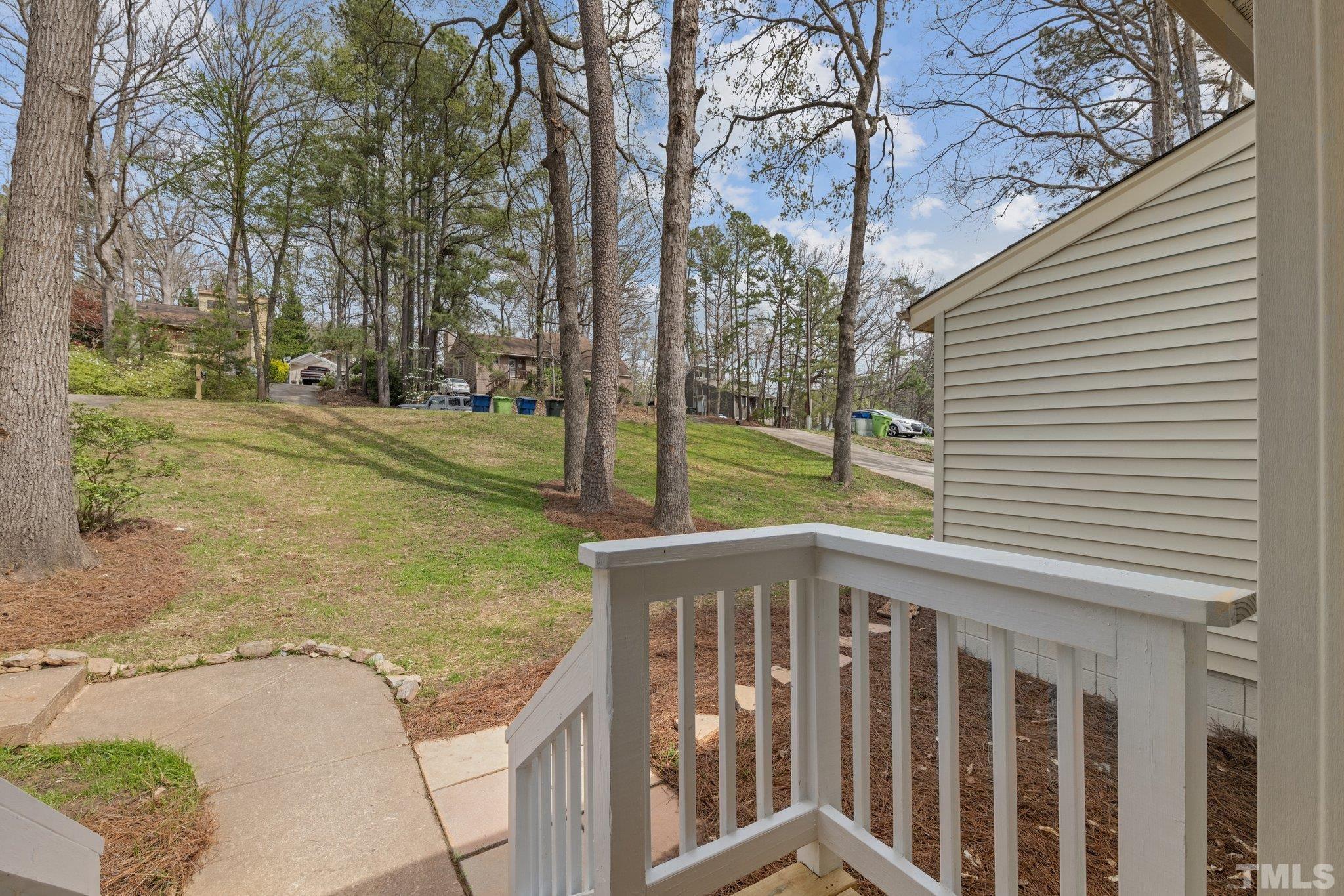 4006 Arckelton Drive, Unit 4006 & 4004 Raleigh, NC 27612 - Photo 9 of 34 a view of a porch with a yard