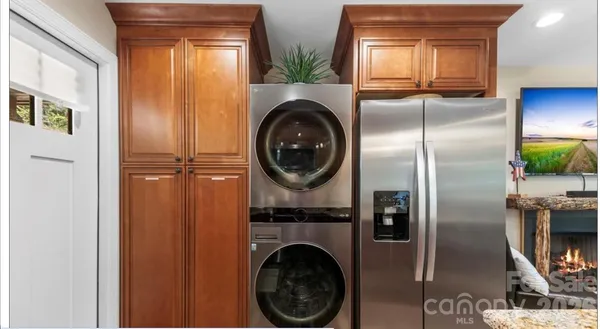 a kitchen with a stove a sink and a refrigerator