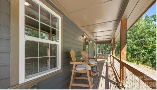 a view of balcony with furniture
