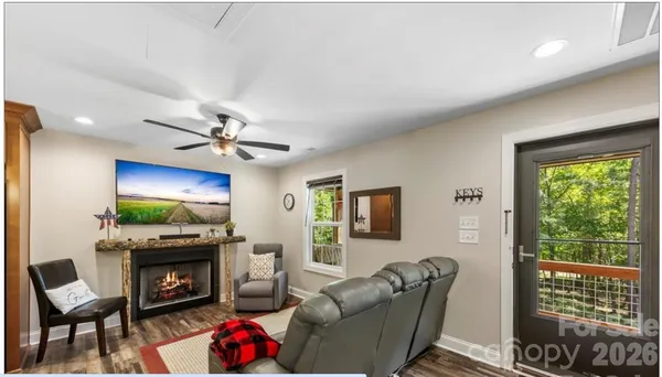 a living room with furniture window and wooden floor