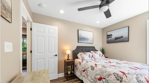 a bedroom with bed and a window