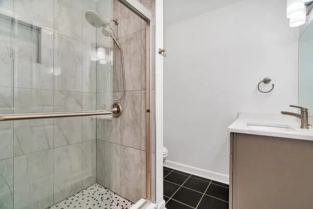 a bathroom with a shower and sink