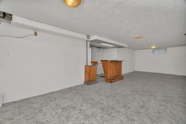 a view of a storage & utility room with wooden floor
