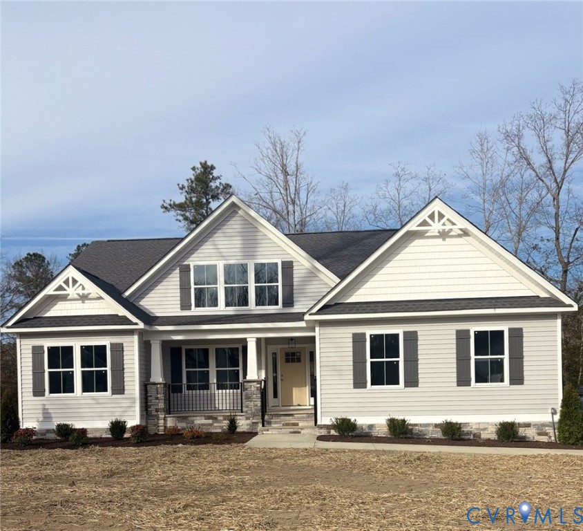 Craftsman-style home with roof with shingles and c