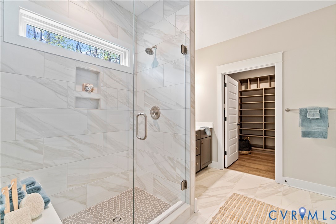 2219 Silver Street Aylett, VA 23009 - Photo 14 of 16 Bathroom featuring a spacious closet, a shower sta