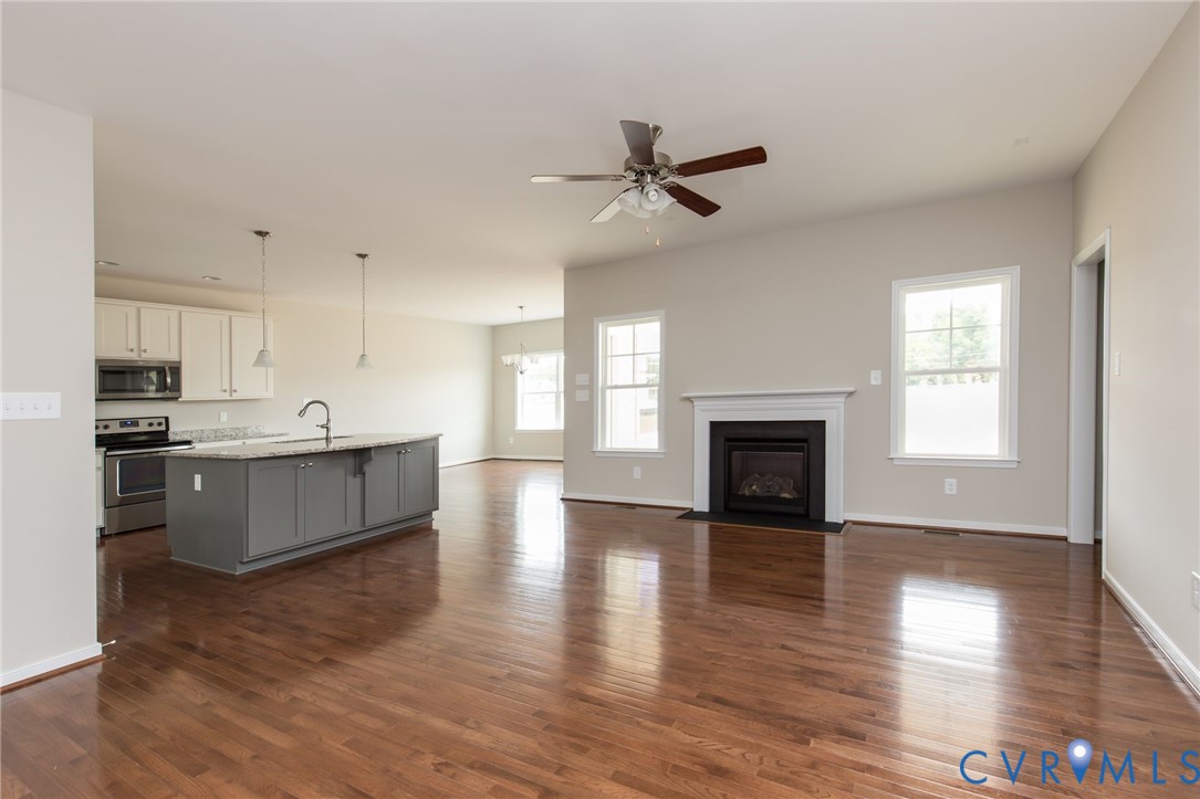 2219 Silver Street Aylett, VA 23009 - Photo 2 of 16 Unfurnished living room with ceiling fan, dark woo