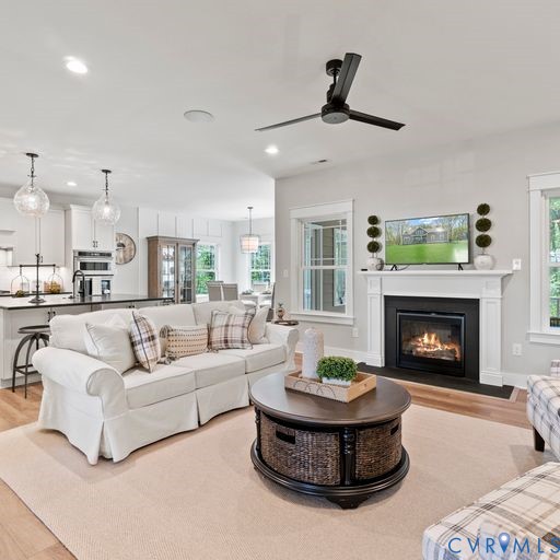 2219 Silver Street Aylett, VA 23009 - Photo 4 of 16 Living room with light wood-style flooring, a glas