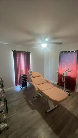 a room with gym equipment and a table