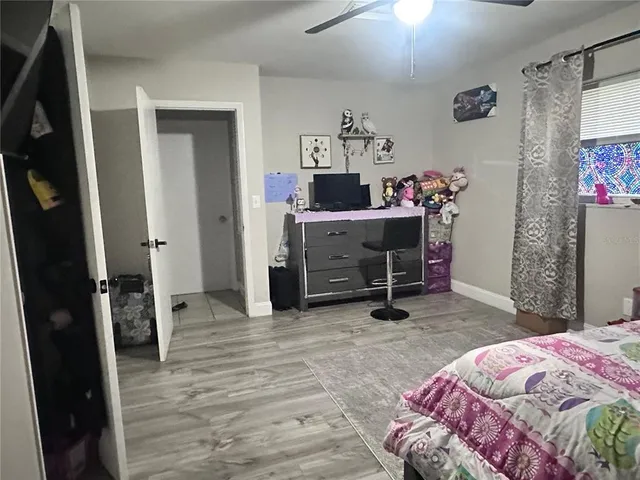 a bedroom with a bed and a dresser