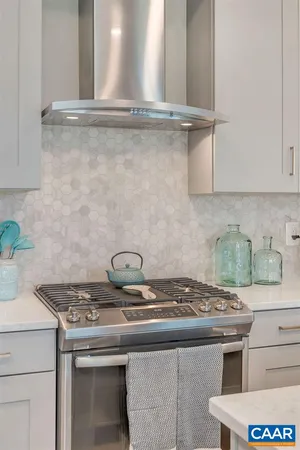a kitchen with a sink a counter space and stainless steel appliances