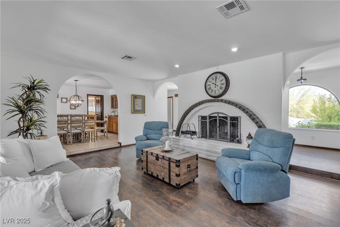 1780 Westwind Road Las Vegas, NV 89146 - Photo 27 of 61 Cozy Fireplace in the spacious Living room with French doors to access the beautiful backyard oasis