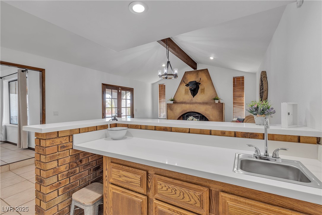 1780 Westwind Road Las Vegas, NV 89146 - Photo 30 of 61 Wet Bar overlooking the cozy fireplace in Family Room