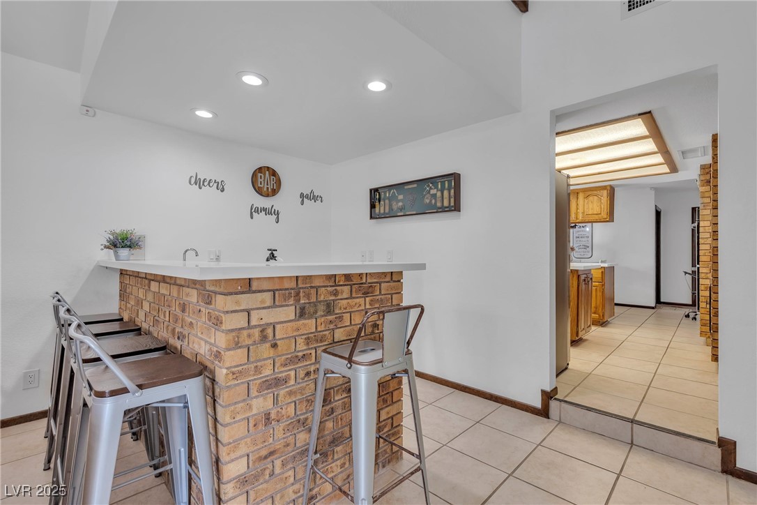 1780 Westwind Road Las Vegas, NV 89146 - Photo 31 of 61 Wet Bar overlooking the cozy Fireplace in Family Room