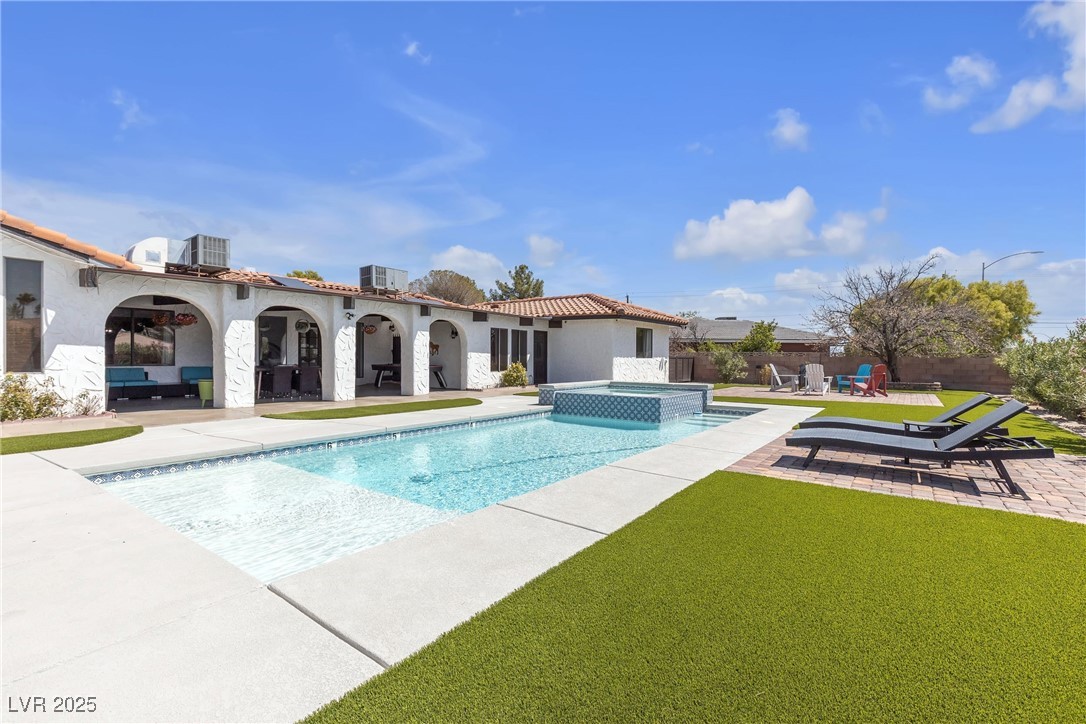 1780 Westwind Road Las Vegas, NV 89146 - Photo 5 of 61 Brand New heated Swimming Pool & Spa with waterfall