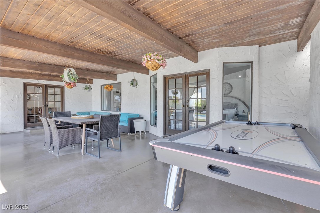 1780 Westwind Road Las Vegas, NV 89146 - Photo 55 of 61 Covered patio with 2 access french doors to inside and offers game room and sitting area