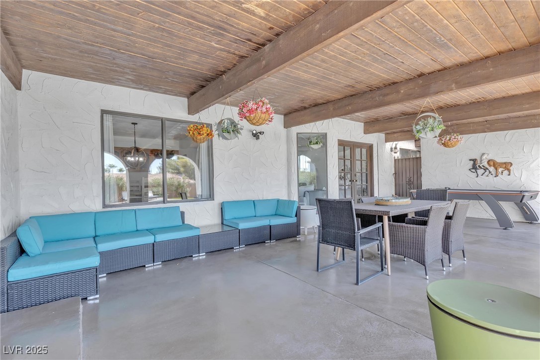 1780 Westwind Road Las Vegas, NV 89146 - Photo 9 of 61 Covered patio with 2 access doors to inside and room for Game area plus gatherings