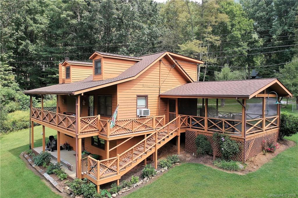 263 Laurel Branch Road Maggie Valley, NC 28751 - Photo 1 of 32 a front view of a house with garden
