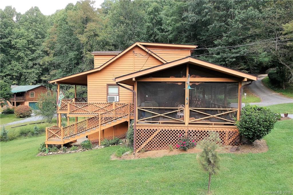 263 Laurel Branch Road Maggie Valley, NC 28751 - Photo 2 of 32 a view of a house with a yard