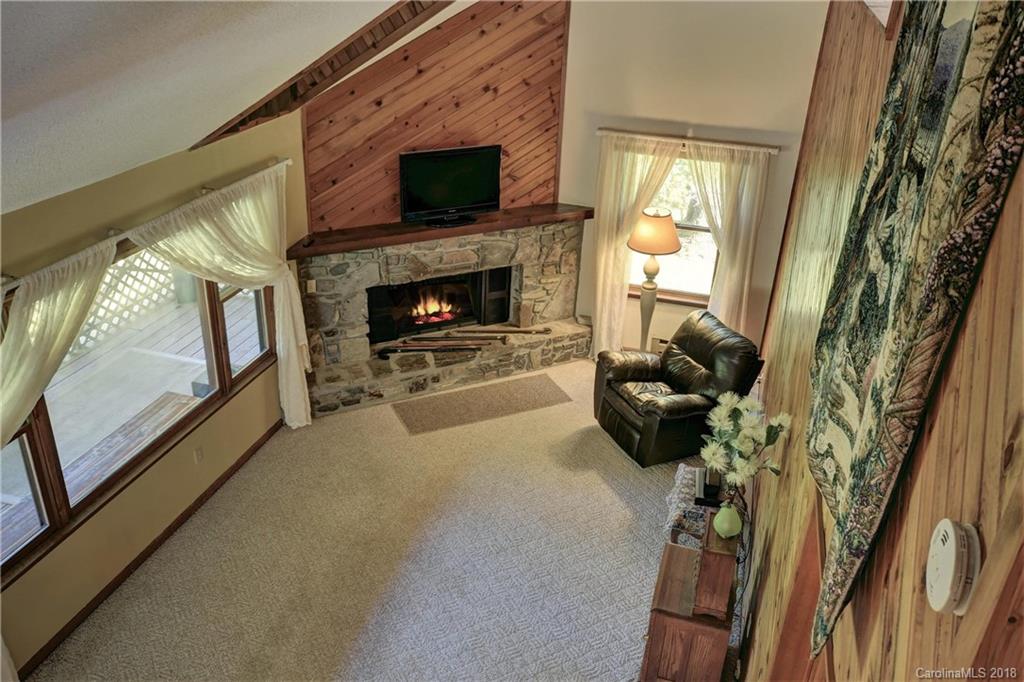 263 Laurel Branch Road Maggie Valley, NC 28751 - Photo 19 of 32 a living room with furniture and a fireplace