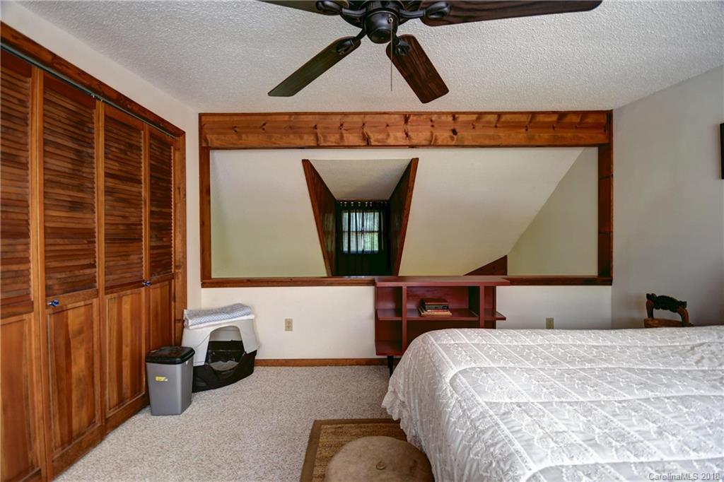 263 Laurel Branch Road Maggie Valley, NC 28751 - Photo 22 of 32 a bedroom with bed and window