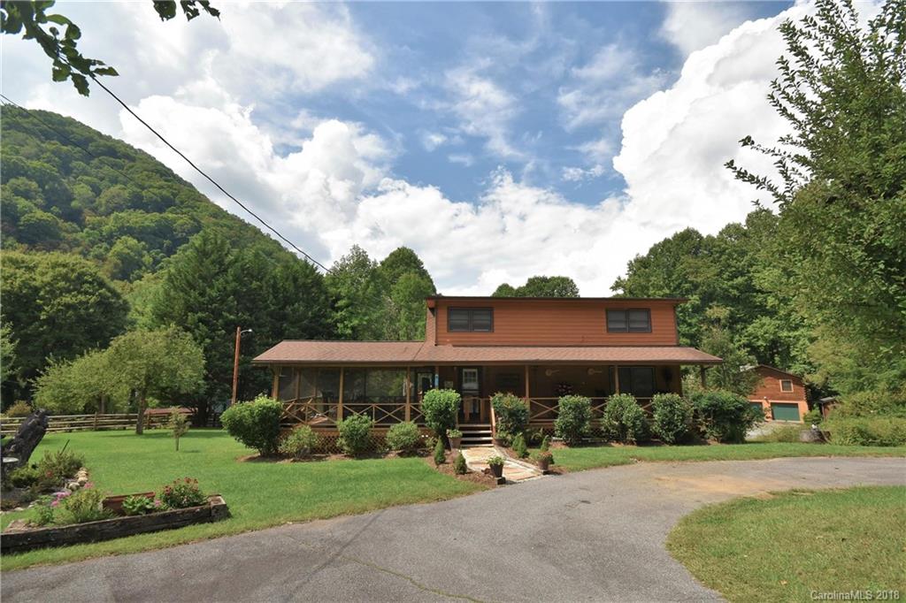 263 Laurel Branch Road Maggie Valley, NC 28751 - Photo 26 of 32 a front view of a house with garden